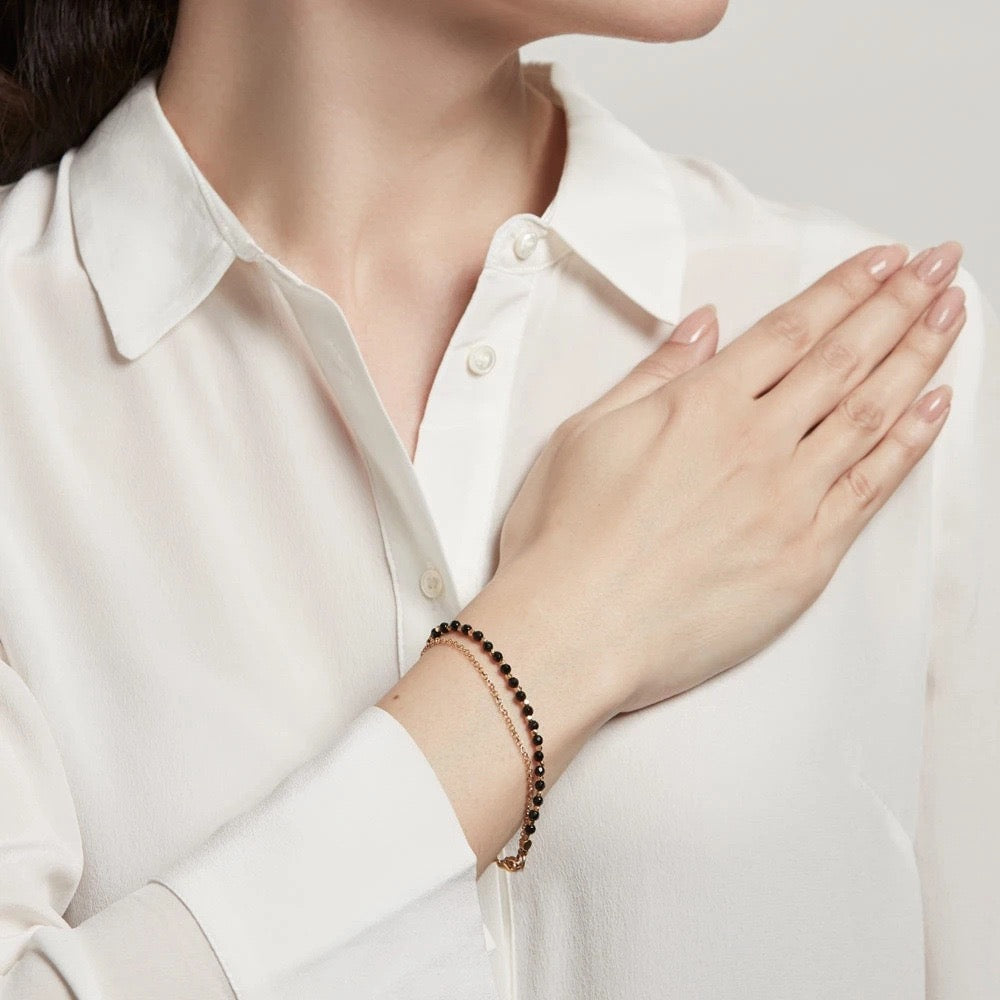 Black Agate healing crystal bracelet worn on female model hand