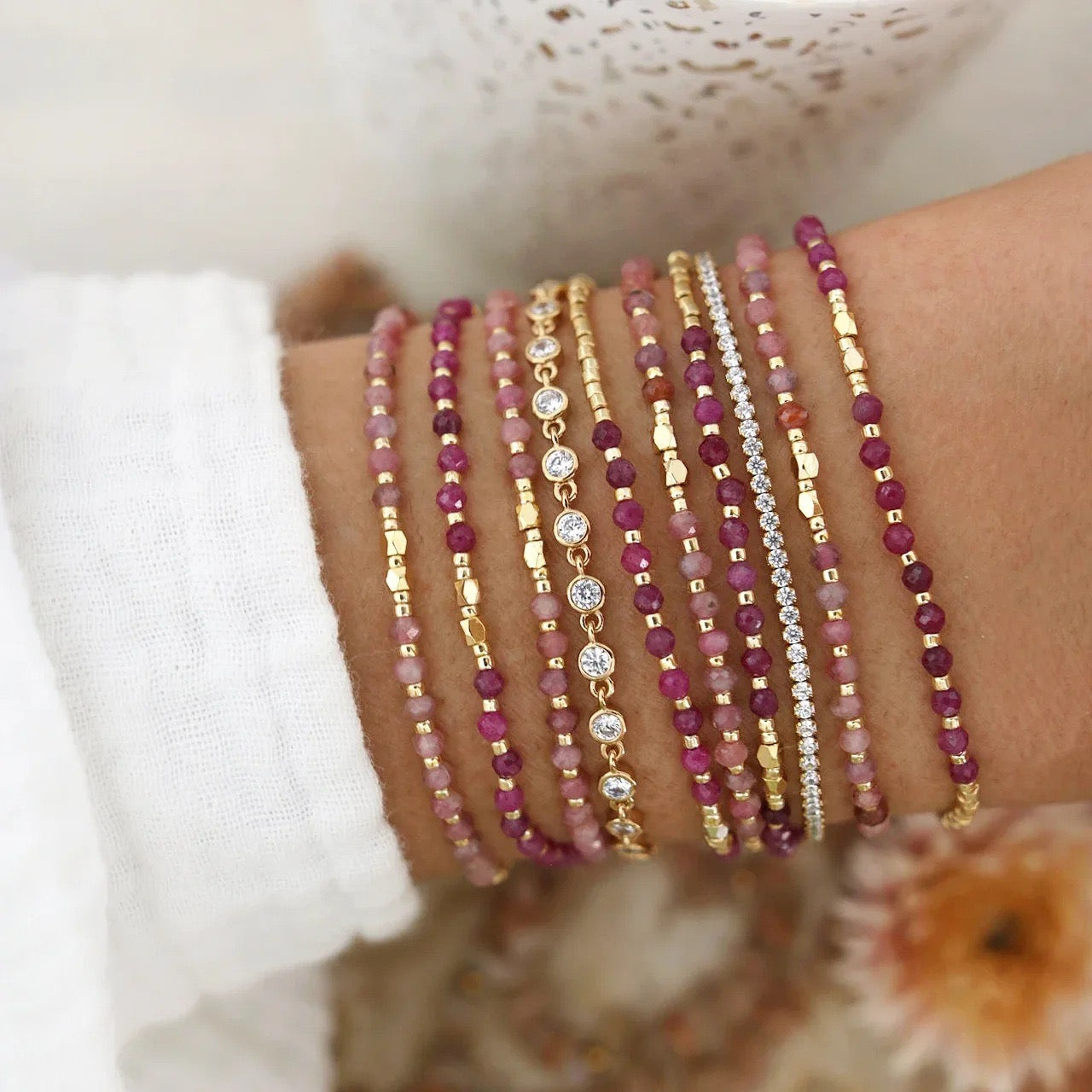 Assorted gemstone bracelets shown in a stacked gift set