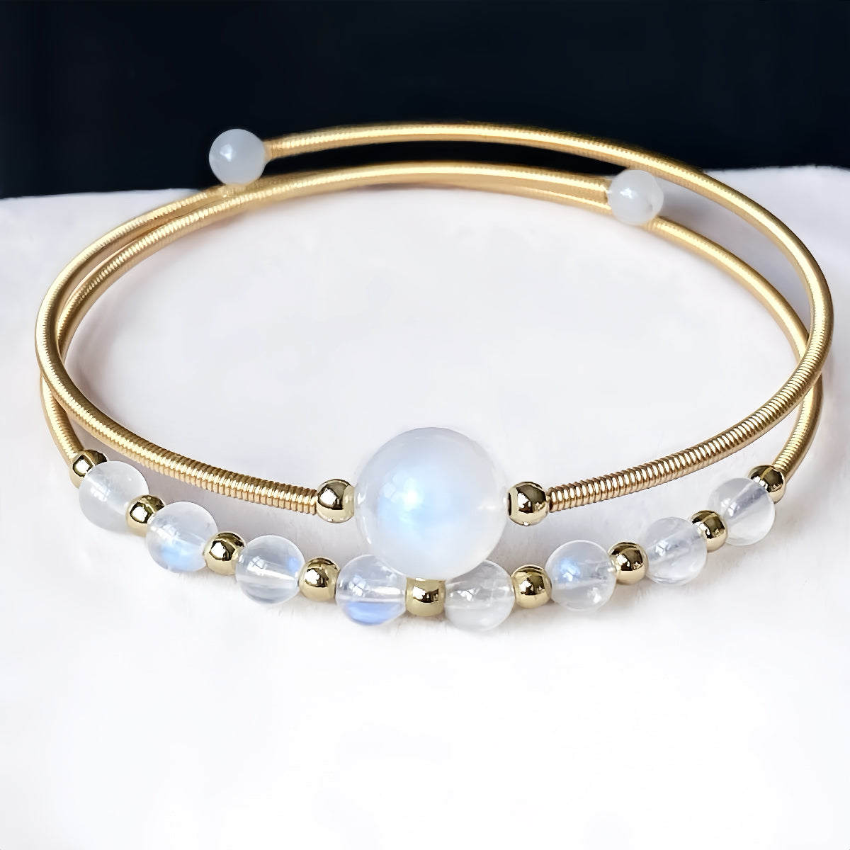 White moonstone bangle with subtle glow, intuitive energy