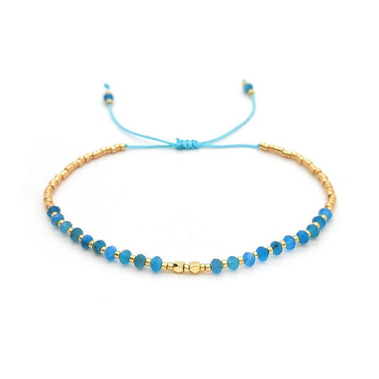 Adjustable bracelet with blue apatite stones and gold accents