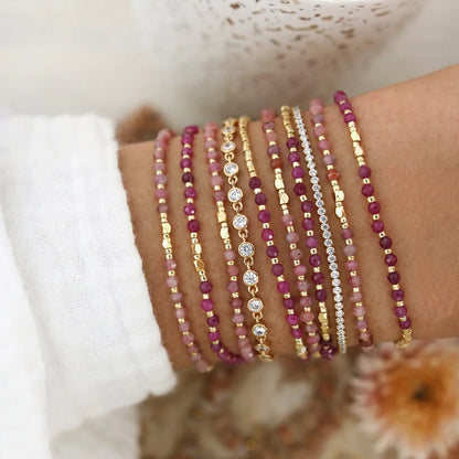 Assorted gemstone bracelets shown in a stacked gift set