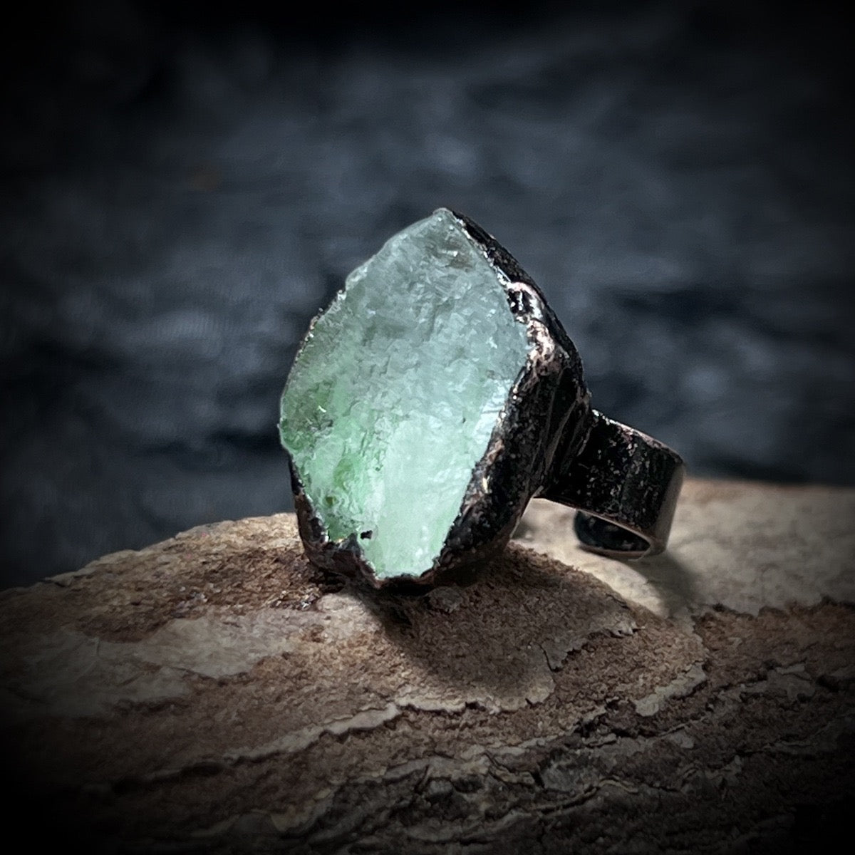 green fluorite raw crystal ring close-up

