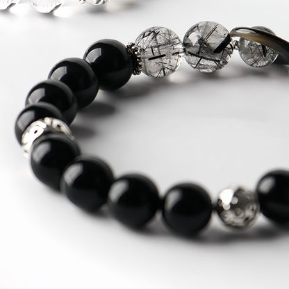 Close-up of obsidian crystal bracelet  