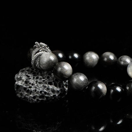 Side angle of black crystal bracelet with blue labradorite glow