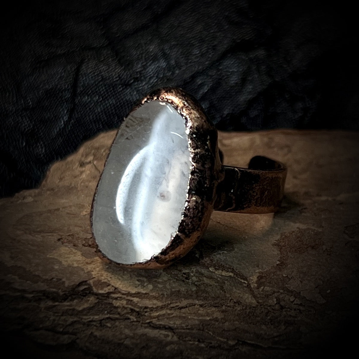 polished clear quartz ring with copper setting
