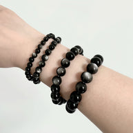 Side view of Silver Sheen Obsidian bracelet on male wrist

