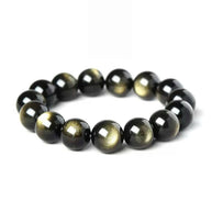 Golden Obsidian bracelet with reflective gold sheen on white background